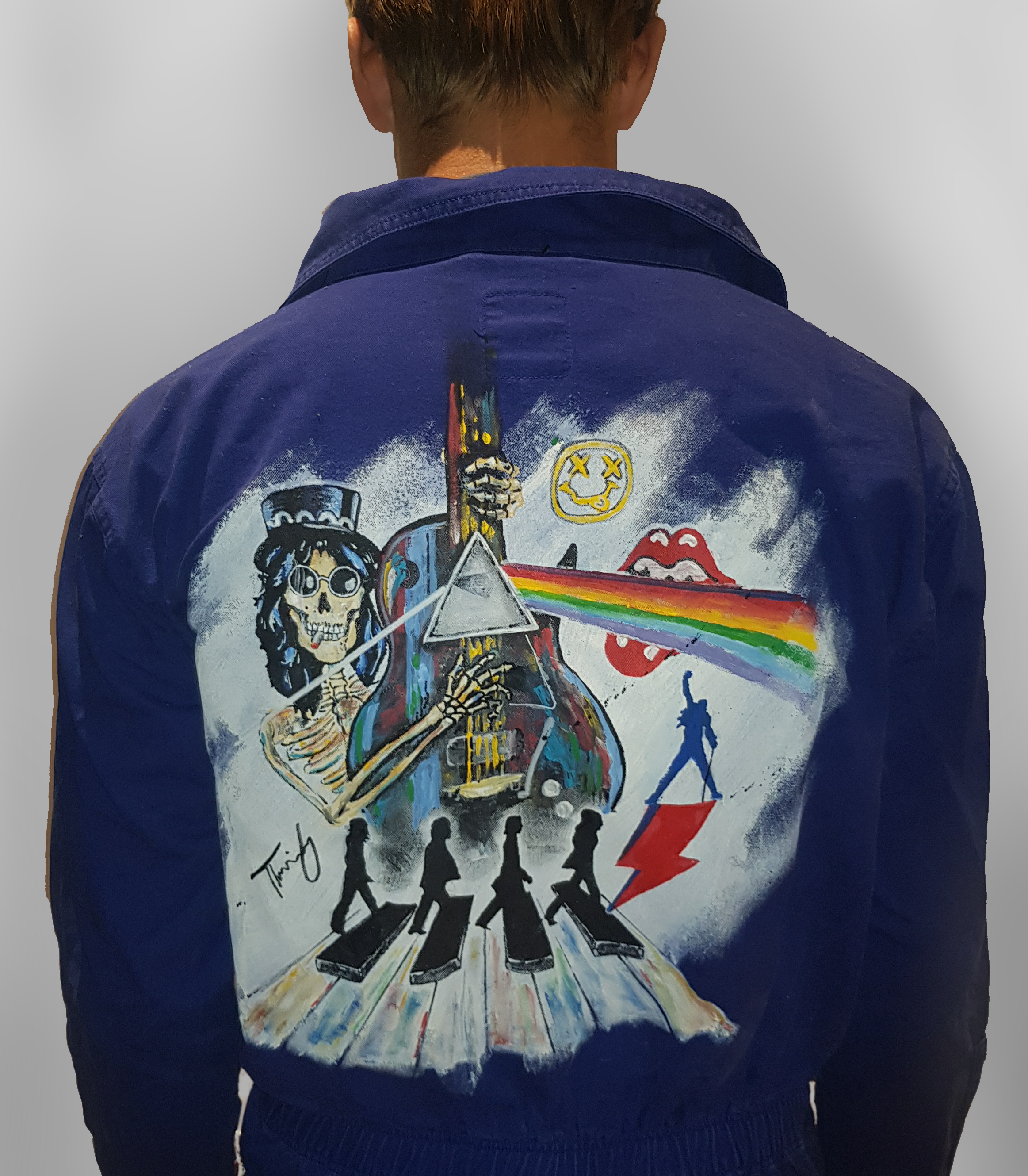 picture of a norwegian graduation suit with paintongs fo band logos